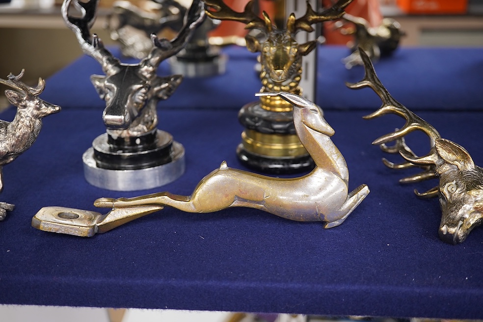 Five chrome and brass car radiator mascots; three in the form of stags’ heads, a stag standing on an oak branch and an Art Deco leading gazelle. Condition - fair, some losses to chrome plating.